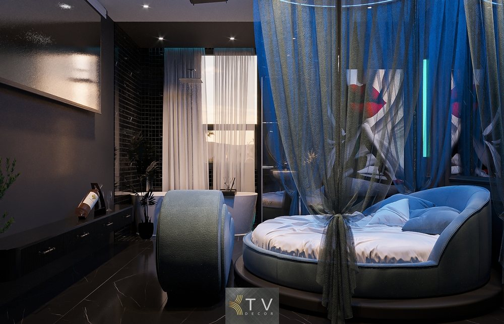 Thiết kế phòng khách sạn tình yêu tông xanh sang trọng với giường tròn, rèm voan mềm mại và ghế tantra – do KTV DECOR thiết kế setup trọn gói.
