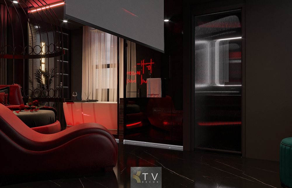 Ghế tantra đỏ, giường tròn LED, màn chiếu 4K, bồn tắm rộng, ánh sáng đỏ – đen gợi cảm trong phòng khách sạn tình yêu.