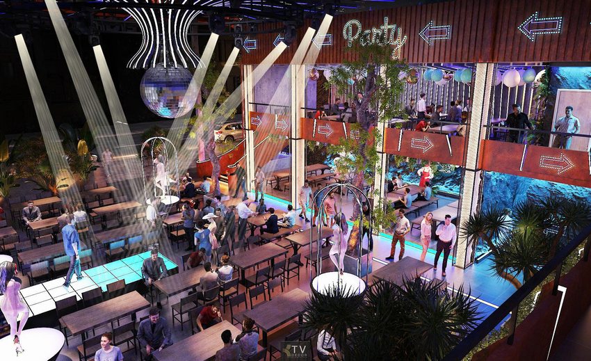 Không gian Beer Garden tại TP.HCM – thiết kế mở hai tầng với ánh sáng sân khấu và mảng xanh mang đến trải nghiệm giải trí sôi động.