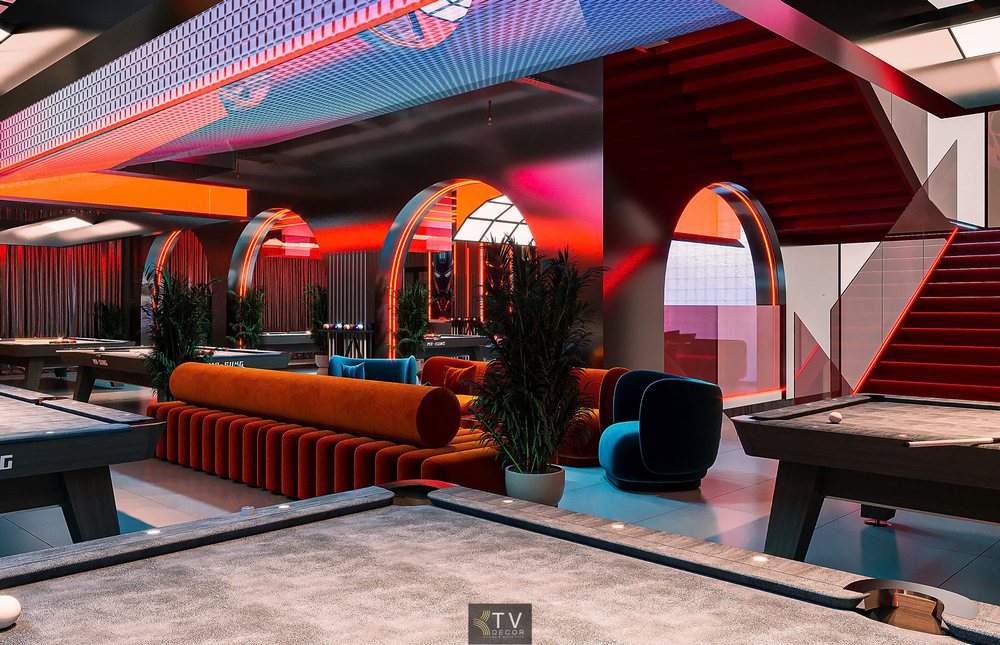 Ảnh THIẾT KẾ thể hiện sự tinh tế trong thiết kế Club BiDa khi KTV DECOR kết hợp hài hòa giữa khu vực thi đấu và không gian thư giãn. Ghế sofa dài màu cam với dáng tròn nổi khối, kết hợp ghế bành nhung xanh dương, tạo nên một khu lounge đẳng cấp, tách biệt nhưng vẫn hòa quyện với khu chơi BiDa.