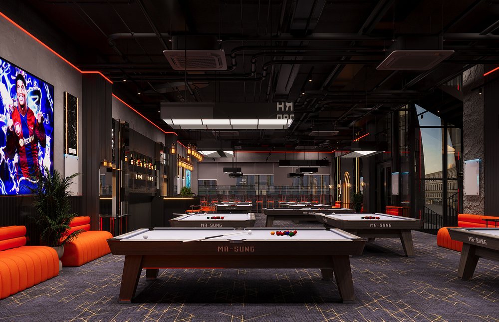 Không gian thiết kế bida hiện đại tại Narra Billiards tầng 1 với bàn thi đấu MA-SUNG, sofa cam nổi bật và ánh sáng trần tối phong cách công nghiệp