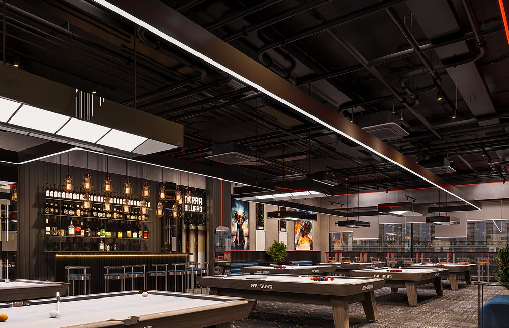 Không gian quầy bar tại Club Billiard tầng 2 NARRA, nổi bật với hệ đèn thả và trần đen lộ kỹ thuật.
