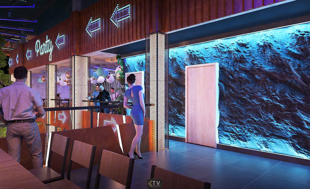Khu vực lầu Beer Garden với hiệu ứng ánh sáng neon, vách đá xanh ấn tượng, mang đậm không khí nightlife hiện đại và sôi động.
