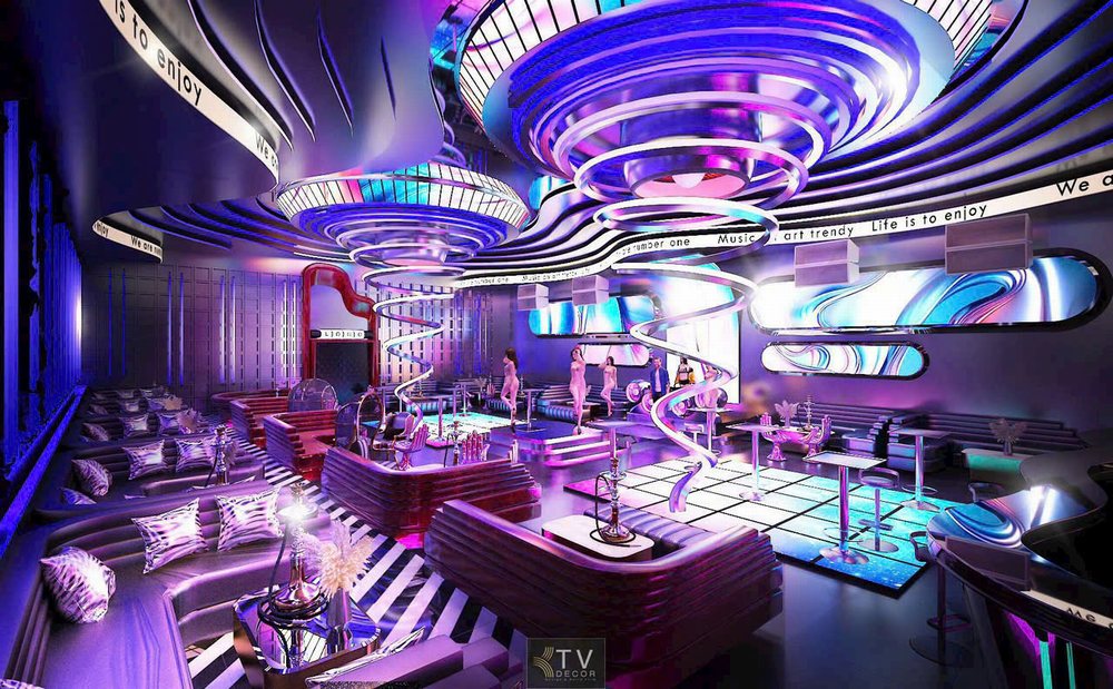 không gian trung tâm quán Bar – Lounge do KTV DECOR thiết kế, với sàn LED phát sáng đa màu, trần LED spiral nghệ thuật và bố trí bàn sofa đa tầng cực hợp xu hướng nightlife.