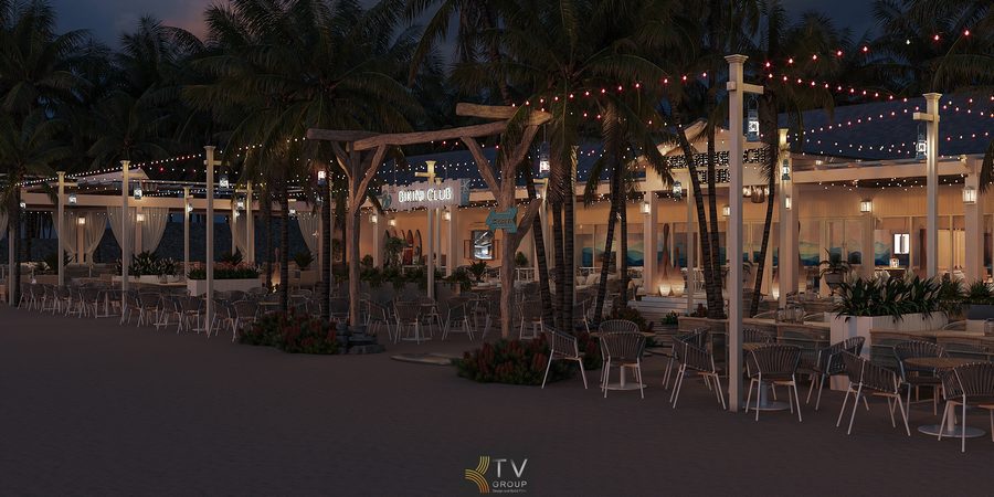 Góc ngồi ngoài trời của nhà hàng được bao quanh bởi ánh đèn dây và cây dừa, thiết kế thanh lịch với vật liệu tự nhiên và tông màu ấm.