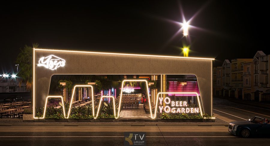 Thiết kế Beer Garden ngoài trời với bàn gỗ dài và trần cây xanh. Không gian Beer Garden hiện đại với ánh sáng LED và hàng ghế gỗ. Nhà hàng Beer Garden thiết kế mở với trần phủ cây và đèn trang trí.