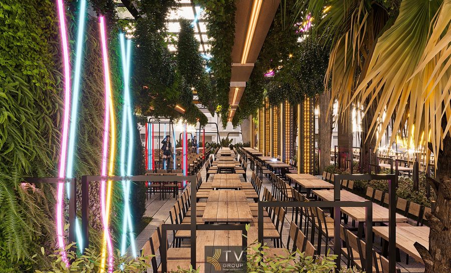 Không gian Beer Garden nhiều ánh sáng với trang trí cây xanh treo. Thiết kế Beer Garden rộng lớn phù hợp tiệc nhóm và sự kiện. Khu vực Beer Garden có trần kính và mảng xanh treo tự nhiên. Beer Garden ngoài trời với bố trí bàn ghế đều và ánh sáng rực rỡ.
