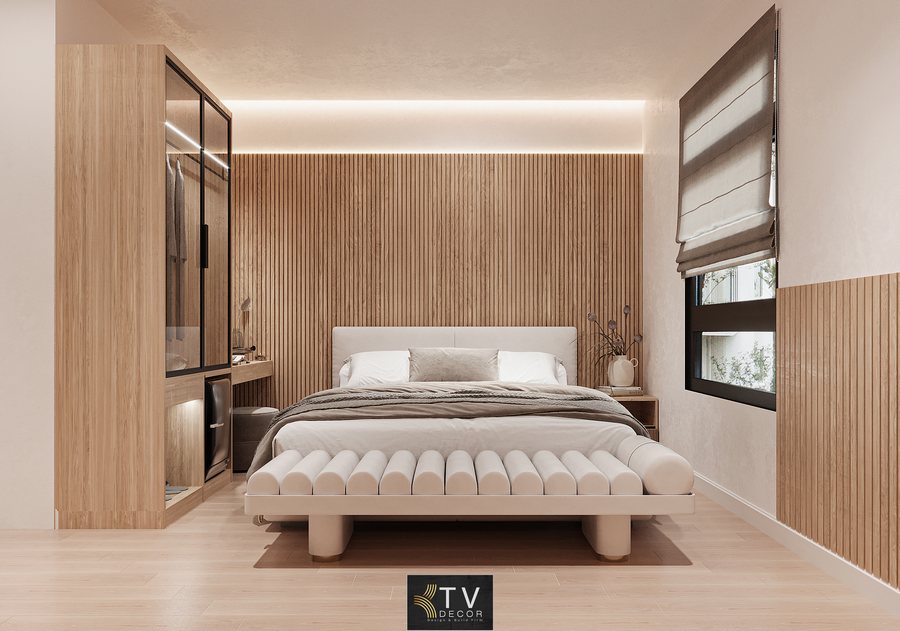 Thiết kế nội thất phòng khách sạn tình yêu phong cách tối giản sang trọng với giường bọc da, ánh sáng hắt trần và không gian xem Netflix riêng tư. 