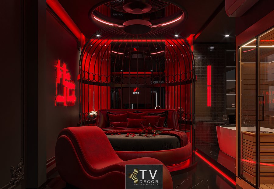 Không gian phòng khách sạn ánh sáng đỏ sang trọng, tường tối màu và bố trí nội thất hiện đại phù hợp phong cách Fantasy Dark Luxury cuốn hút. 