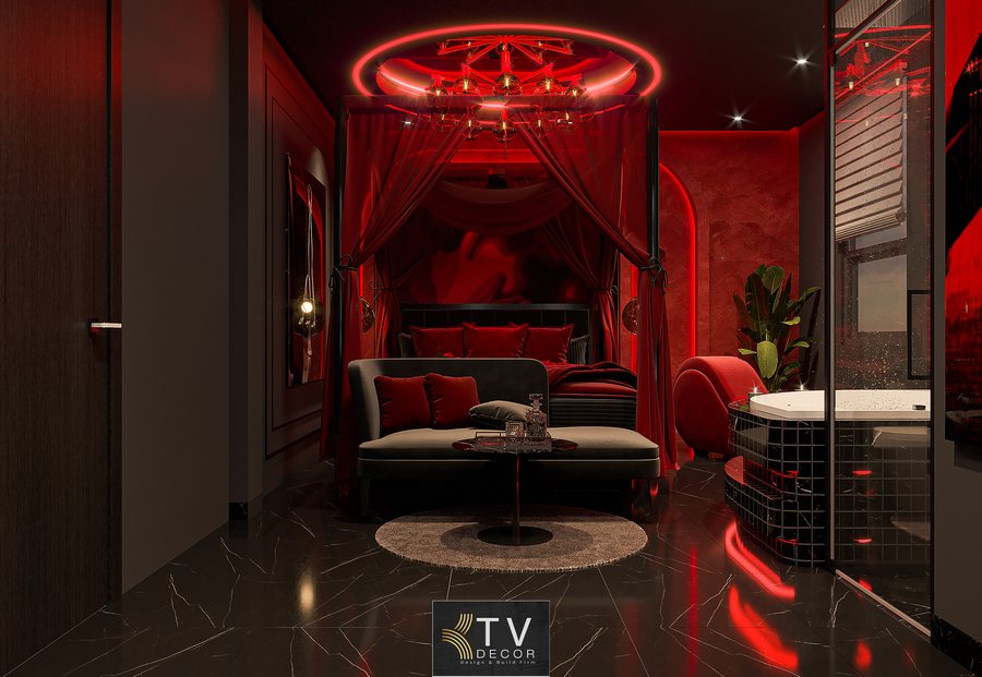 Thiết kế thi công nội thất phòng khách sạn chủ đề tình yêu phong cách Luxury Romantic với ánh sáng đỏ quyến rũ, rèm đỏ, bồn tắm sang trọng và nội thất đen đỏ cao cấp.