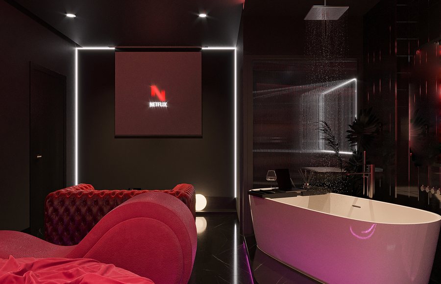 Trần nhà với hệ thống đèn LED neon hồng chạy viền mang lại cảm giác hiện đại và ấm áp.  Bồn tắm đôi trắng đặt trước giường với hiệu ứng nước và cánh hoa tạo không gian thư giãn.