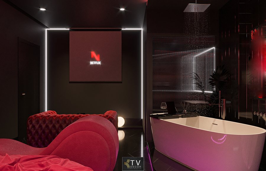 Sofa nhung đỏ dạng dài giúp tạo điểm nhấn sang trọng trong phòng khách sạn chủ đề tình yêu. 