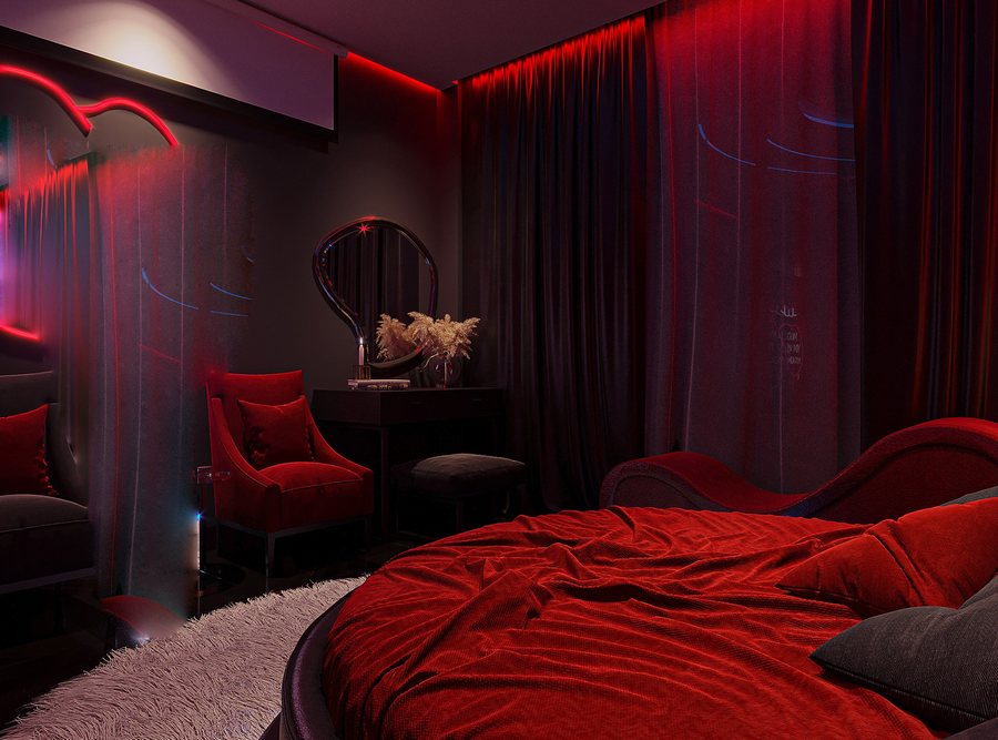 Thiết kế phòng khách sạn tình yêu với giường tròn bọc nhung, ánh sáng neon đỏ tím và hệ gương phản chiếu tạo hiệu ứng lung linh hiện đại và đầy lãng mạn. 