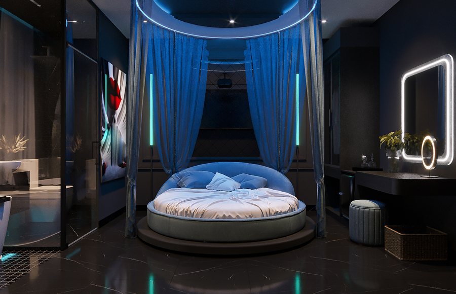 Thiết kế nội thất phòng khách sạn chủ đề Mood Blue hiện đại với giường tròn, ánh sáng xanh ấn tượng, rèm voan mềm và vật liệu sang trọng theo phong cách trẻ trung. 