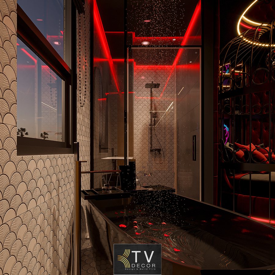 alt: Thiết kế thi công nội thất phòng khách sạn chủ đề tình yêu lãng mạn với giường tròn trong lồng sắt nghệ thuật và ánh sáng LED đỏ cuốn hút 