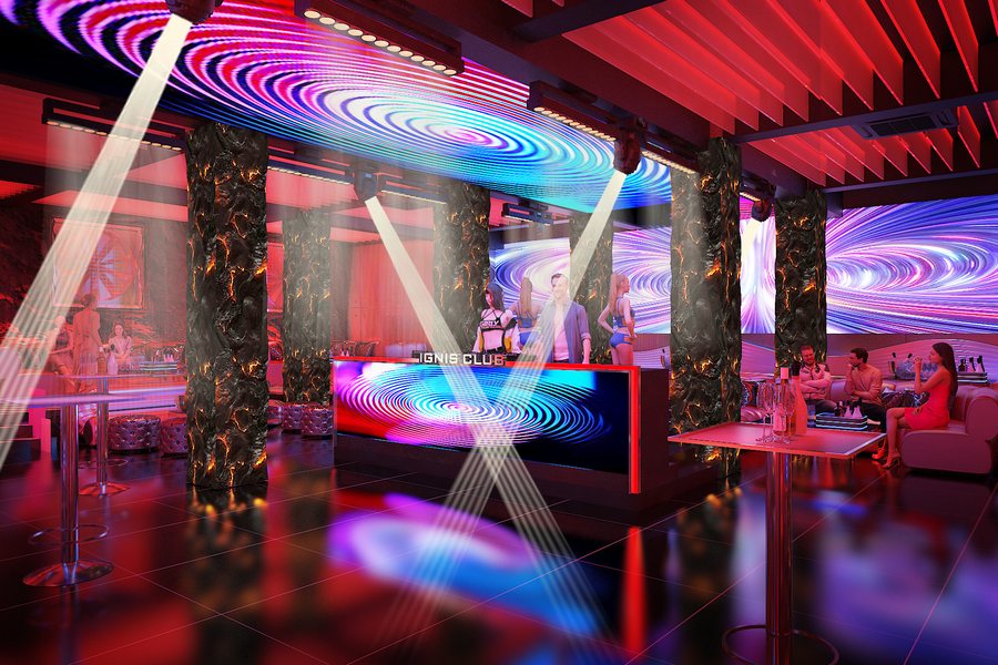 Không gian Bar Club TPHCM hiện đại với màn hình LED cỡ lớn, ánh sáng sân khấu rực rỡ và khu vực DJ chuyên nghiệp. 