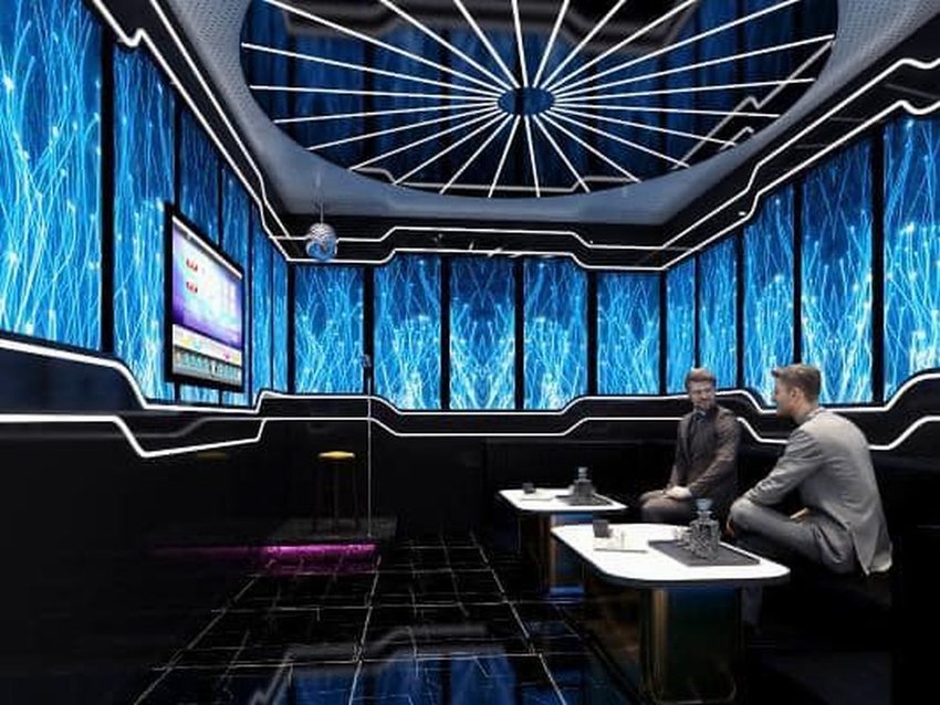 Thiết kế thi công karaoke phong cách hiện đại với trần đèn LED nghệ thuật, vách tường ánh sáng xanh nổi bật, không gian giải trí đẳng cấp. 