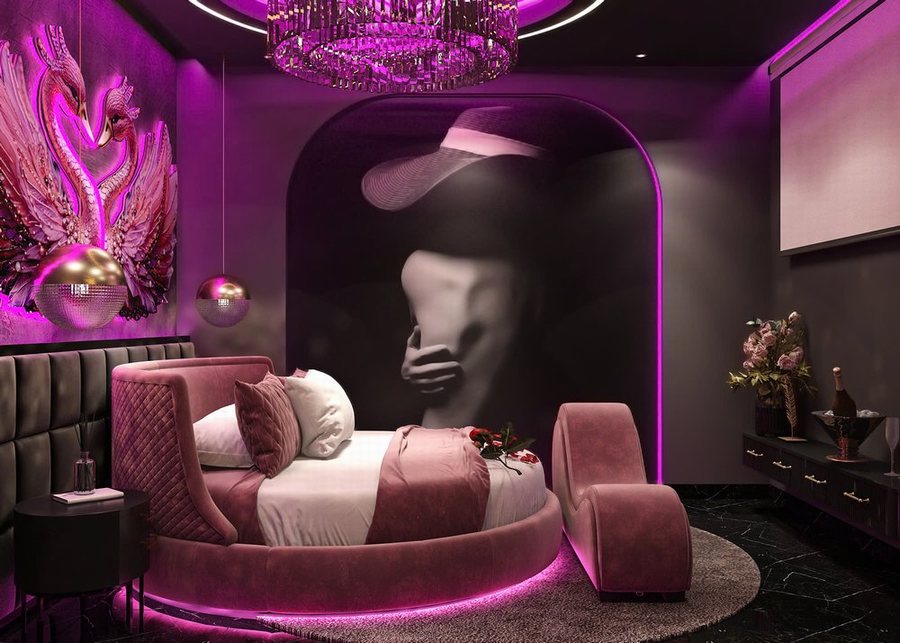 thiết kế thi công phòng khách sạn tình yêu tại TP.HCM – giường tròn, ánh sáng LED tím, phong cách sexy nghệ thuật