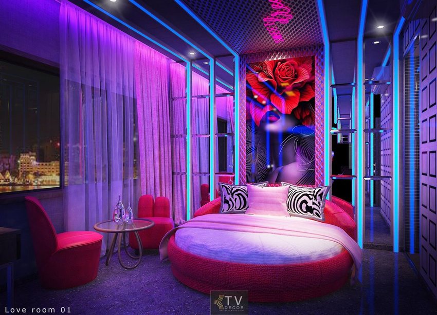 Thiết kế thi công khách sạn và khách sạn tình yêu tại Vũng Tàu với phòng ngủ giường tròn, tranh nghệ thuật hoa hồng, ánh sáng neon tím xanh