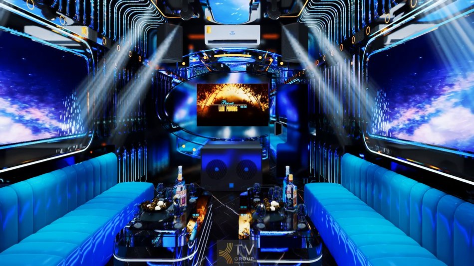 Phòng karaoke KTV hiện đại màu xanh ánh kim, bố trí sofa dài hai bên, bàn kính trung tâm, đèn LED hiệu ứng và hệ thống âm thanh chuyên nghiệp.
