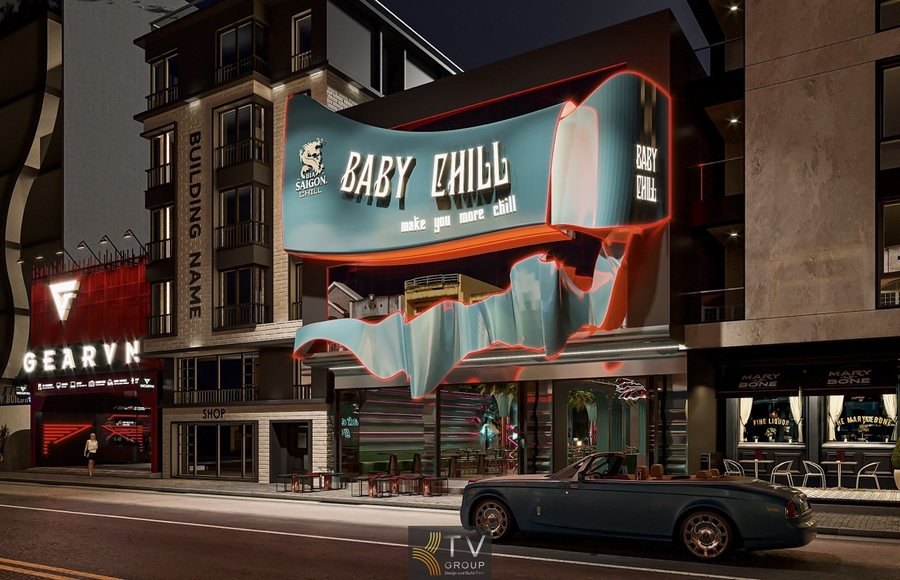 lt 1: Bảng hiệu lớn chữ BABY CHILL ánh sáng LED trắng  Alt 2: Toàn cảnh mặt tiền nhà hàng với thiết kế uốn lượn 3D  Alt 3: Khu vực bàn ghế ngoài trời trước nhà hàng phong cách mở  Alt 4: Tòa nhà hiện đại bên cạnh với nhiều ban công sáng đèn  Alt 5: Xe hơi đỗ trước mặt tiền nhà hàng vào buổi tối 