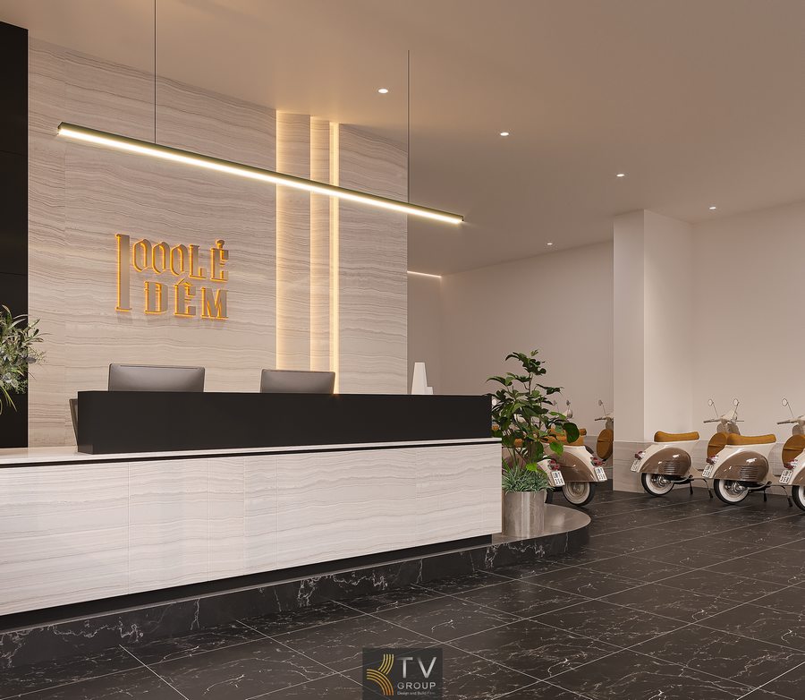 Quầy lễ tân khách sạn hiện đại với đá vân sáng, ánh sáng LED hắt tường và logo nổi tạo cảm giác sang trọng, chuyên nghiệp