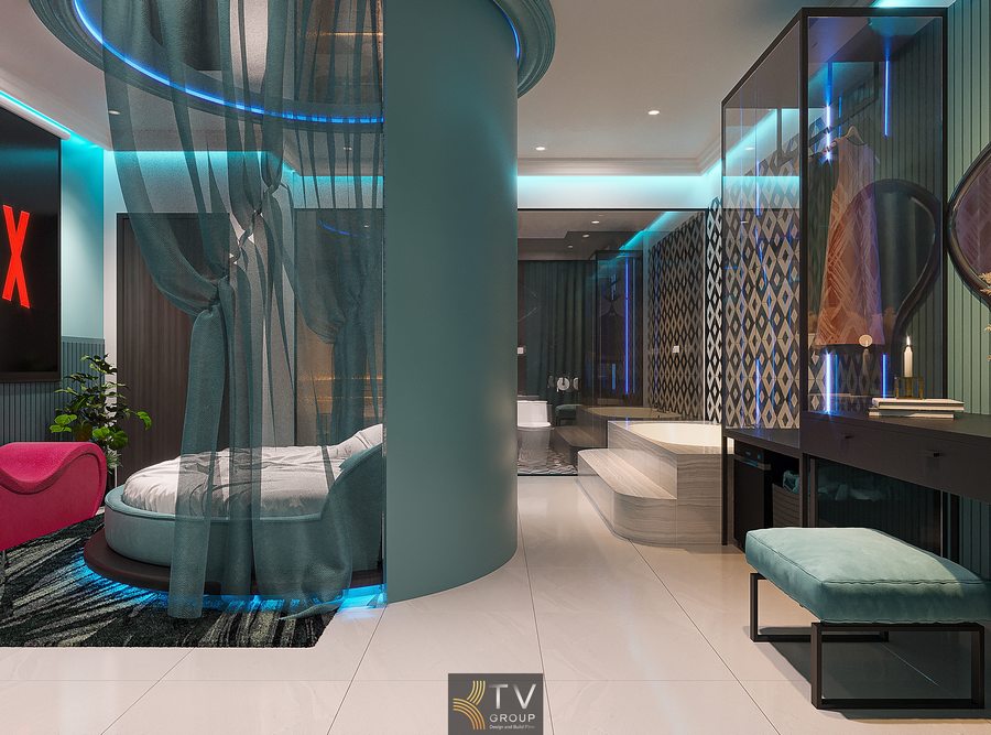 Phòng khách sạn phong cách hiện đại với gương phản chiếu, ánh sáng xanh và bố cục không gian liền mạch Thiết kế phòng khách sạn sang trọng với giường tròn, vách kính và ánh sáng gián tiếp tạo trải nghiệm khác biệt 