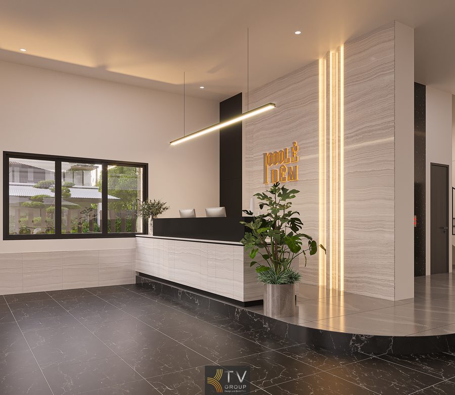 Khu vực tiếp tân khách sạn thiết kế tối giản với quầy đá sáng, đèn linear treo trần và không gian rộng rãi, thoáng đãng