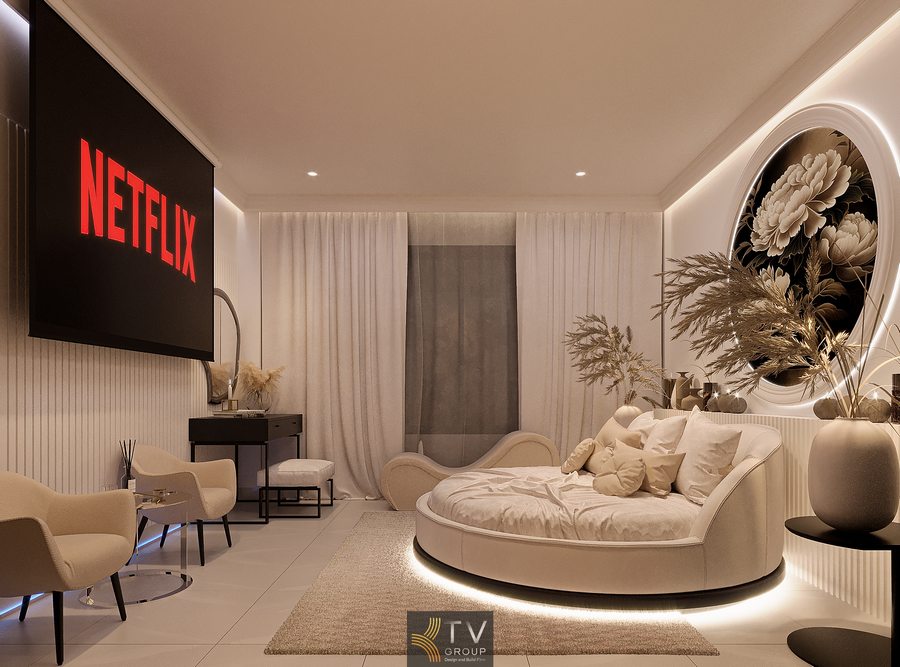 Phòng khách sạn Neo Luxury tông be ấm, giường bo cong trung tâm, ánh sáng LED dịu nhẹ tạo cảm giác thư giãn và riêng tư