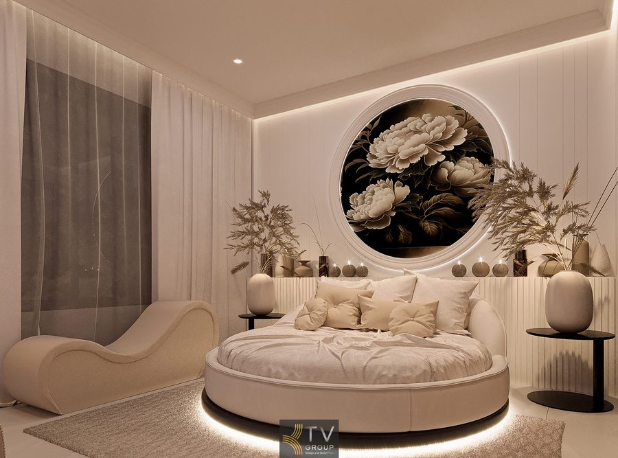 Thiết kế phòng khách sạn hiện đại với giường tròn bọc nỉ, decor tranh nghệ thuật và ánh sáng dịu tạo điểm nhấn