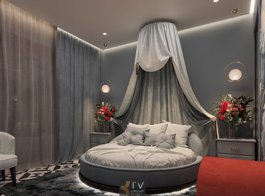 phòng khách sạn phong cách hiện đại nghệ thuật với tranh treo tường lớn nội thất mềm mại và ánh sáng vàng tạo điểm nhấn ấn tượng