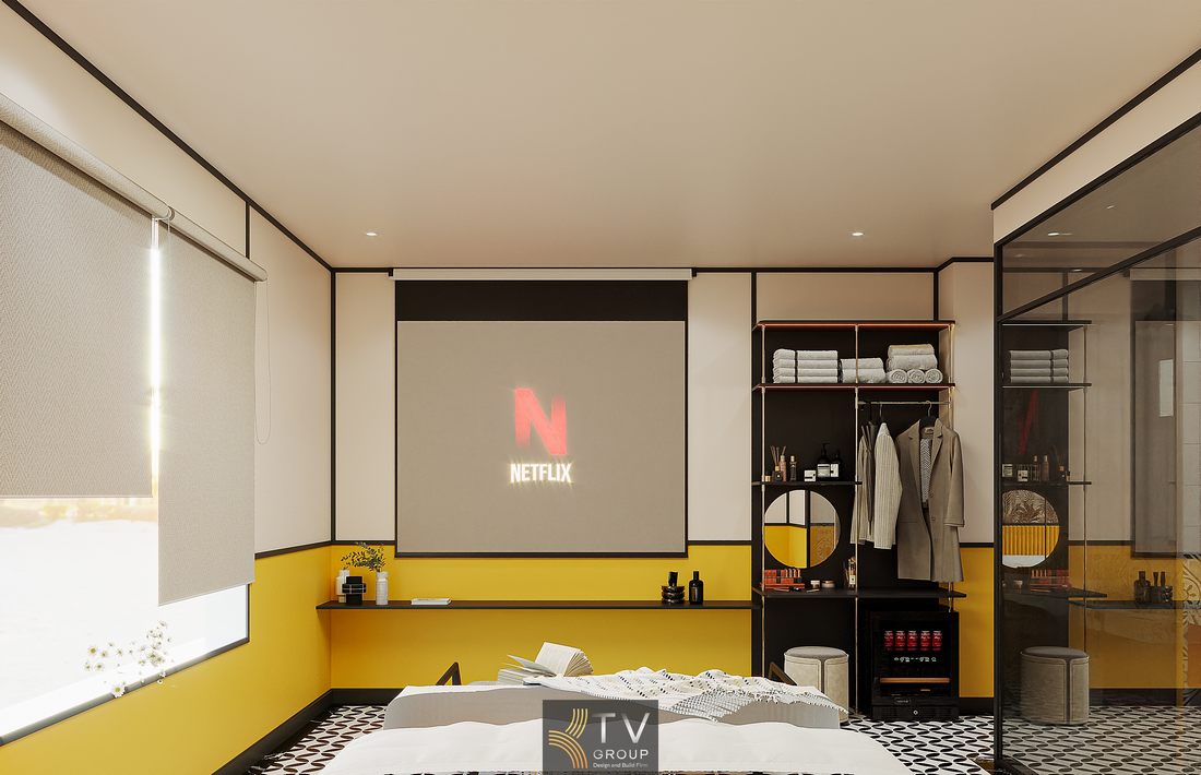 Nội thất phòng khách sạn thiết kế tối giản với điểm nhấn màu sắc mạnh, bố trí đối xứng, sử dụng vật liệu hiện đại và ánh sáng tự nhiên giúp không gian rộng và dễ chịu hơn.