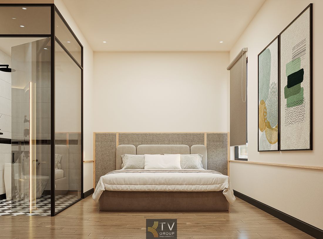 Góc phòng khách sạn đẹp với tông màu trung tính, sàn gỗ và hệ đèn âm trần tạo nên không gian ấm áp và hiện đại 