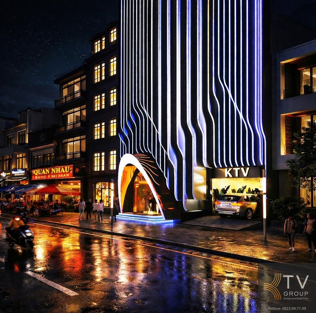 Thiết kế mặt tiền KTV LED uốn lượn nổi bật ban đêm, cổng vòm ánh sáng thu hút, hiệu ứng phản chiếu mặt đường tạo điểm nhấn thị giác mạnh, tăng nhận diện thương hiệu và khả năng thu hút khách. 