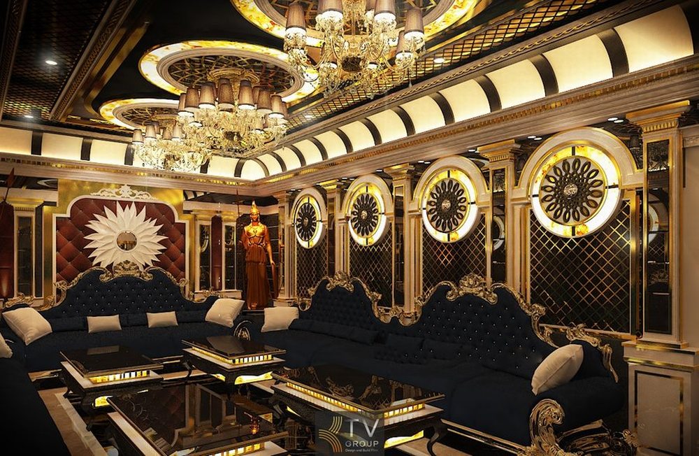 Không gian karaoke cao cấp với thiết kế trần nghệ thuật và hệ thống ánh sáng LED hiện đại trong dự án thiết kế thi công karaoke trọn gói. 