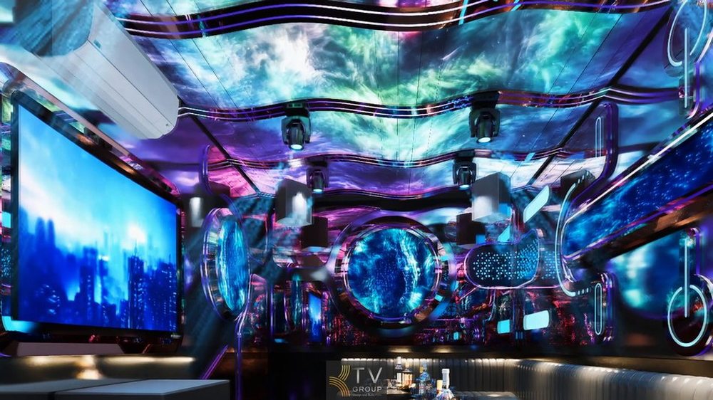 Không gian karaoke cao cấp với trần trang trí độc đáo và ánh sáng LED nhiều lớp trong giải pháp thiết kế thi công karaoke trọn gói chuyên nghiệp. 