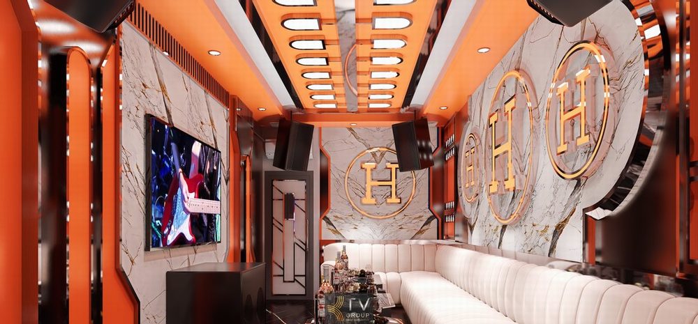 Không gian phòng karaoke VIP sang trọng với sofa bọc da cao cấp, hệ trần trang trí nghệ thuật và ánh sáng LED hiện đại trong dự án thiết kế thi công karaoke trọn gói.  7. 