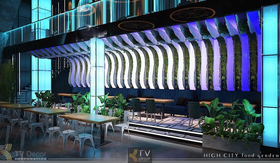 Trung tâm không gian là sân khấu LED kích thước lớn, công nghệ đồ họa chuyển động hiện đại, trở thành điểm tụ hút mọi ánh nhìn. Hai bên là bố trí bàn dài kết hợp ghế kim loại công nghiệp, tạo sự tối ưu công suất phục vụ và phù hợp mô hình Beer Garden đông khách. 