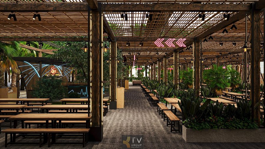 Thiết kế nhà hàng sân vườn mở với hàng ghế gỗ xếp thẳng hàng dưới mái che bằng tre, bao quanh bởi mảng xanh tạo cảm giác thư giãn tự nhiên. 