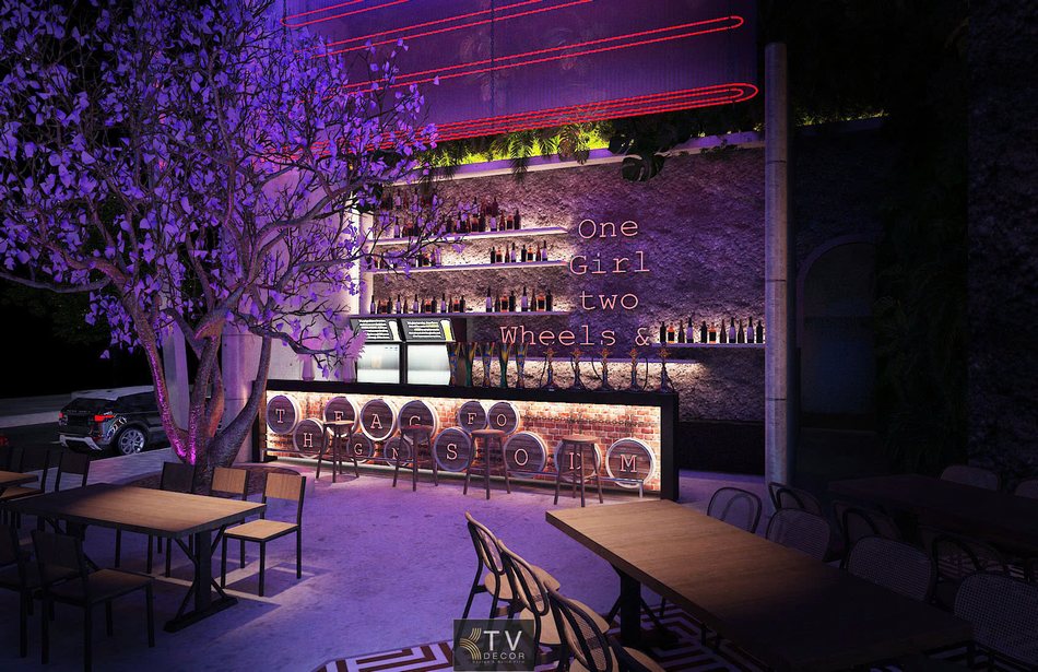 ALT ảnh: Quầy bar Beer Garden phong cách công nghiệp, tường đá, kệ rượu, ánh sáng neon tím – đỏ và bàn ngoài trời tạo không gian chill. 