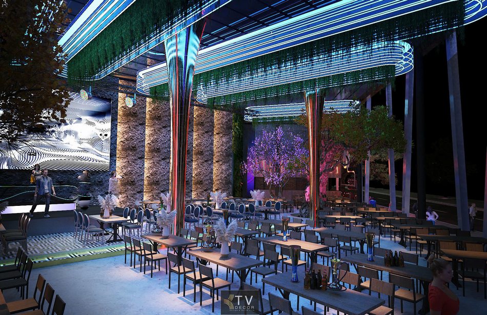 Cây trang trí nội thất kết hợp ánh sáng tím xanh trong Beer Garden.  Sân khấu trung tâm Beer Garden với thiết kế tường đá và ánh sáng dọc.  Không gian Beer Garden với sàn họa tiết đen trắng và bố trí bàn khoa học.  Khu bàn tiệc dài trong Beer Garden dưới hệ trần LED đa tầng.  Toàn cảnh nội thất Beer Garden với ánh sáng RGB mạnh mẽ. 